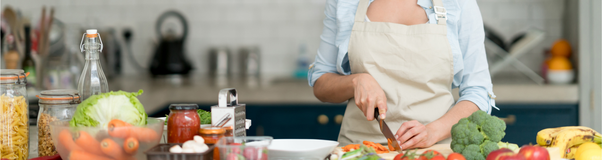 A professional chef makes food in a home kitchen.